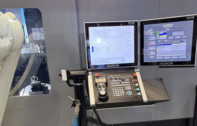 hurco cnc machine with industrial robot with an HMI with OEE